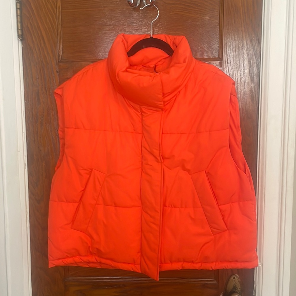 Never worn! Zara bright orange, water repellent puffer vest.